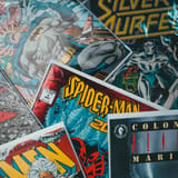 Colorful comic book covers with Spider-Man, Silver Surfer, and Alien Marines, emphasizing Marvel superhero and sci-fi comic themes.