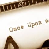 High-quality image of a vintage typewriter with the phrase “Once Upon a Time” typed on it, emphasizing creative writing tools.