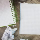 Notepad and graph paper for writing and editing text.
