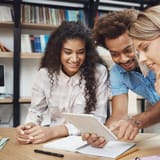 Engaged students using a digital word counter for writing and editing.