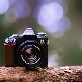 High-quality camera with lens, perfect for photography and capturing beautiful outdoor scenes.
