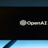 OpenAI logo on a screen, symbolizing artificial intelligence development.
