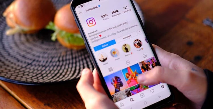 Instagram app on smartphone showing profile with followers and posts.