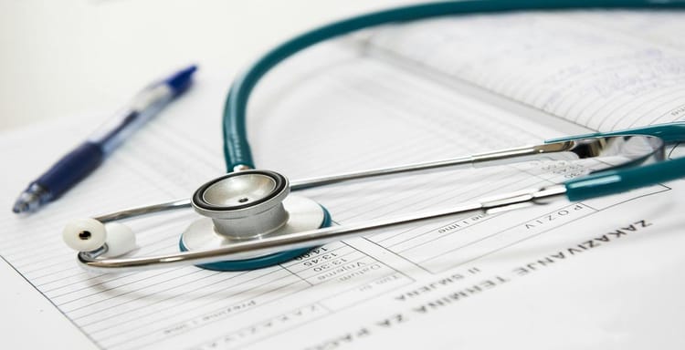 Stethoscope on medical notes representing healthcare, diagnosis, and doctor consultation.