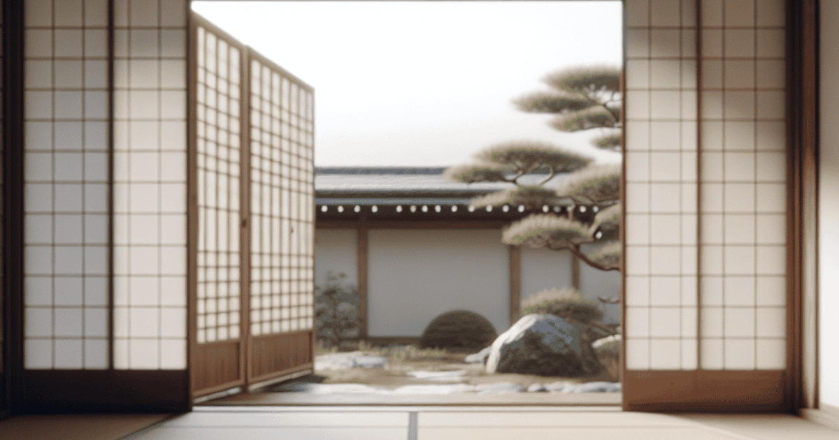 Japanese Zen garden view with traditional calligraphy tools on wooden table, showcasing serenity and mindfulness.