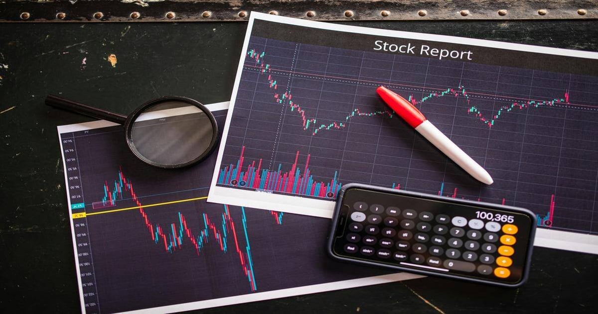 Stock market analysis with financial charts and a calculator for investment insights.
