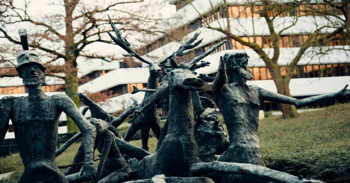 Highly detailed bronze sculptures of mythological figures and warrior statues outdoors.