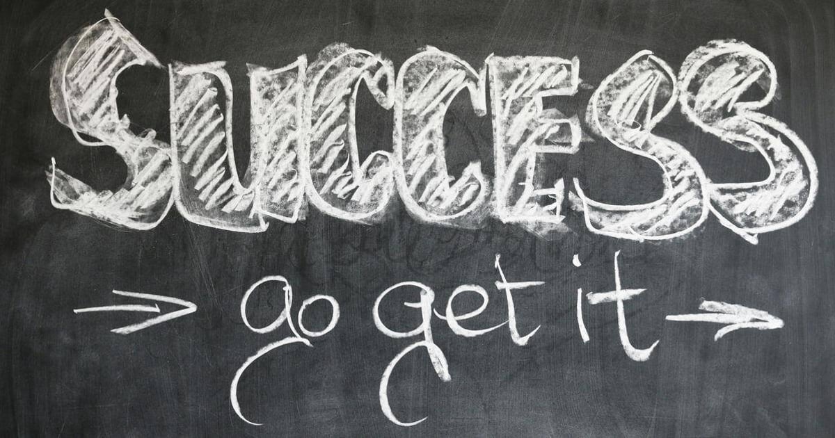 Chalkboard with "Success" and "go get it" motivational message in white chalk.